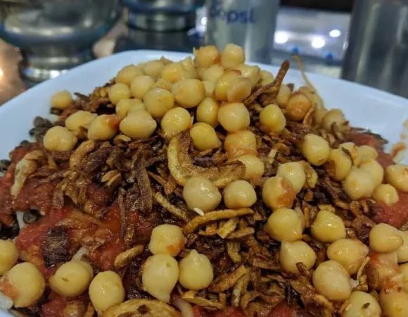 Private Food Tour To The Most Famous Koshary restaurant in Egypt Koshary Abou Tarek